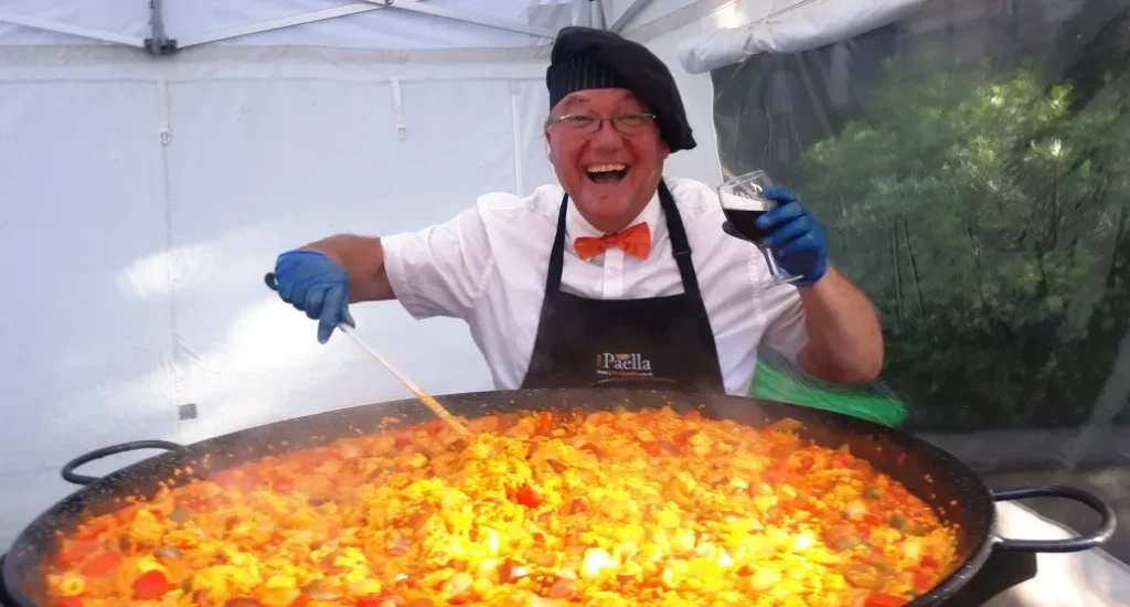 Gary from Your Paella having fun cooking paella